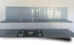 Glass splashbacks versus kitchen and bathroom tiles